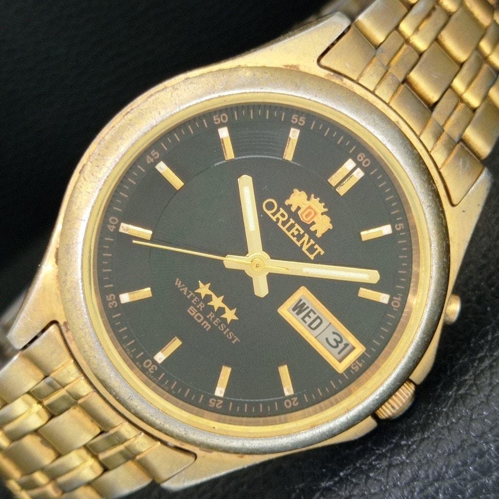 Vintage 1972 Orient Automatic Mens Gold Watch WDaydate  Black Accents